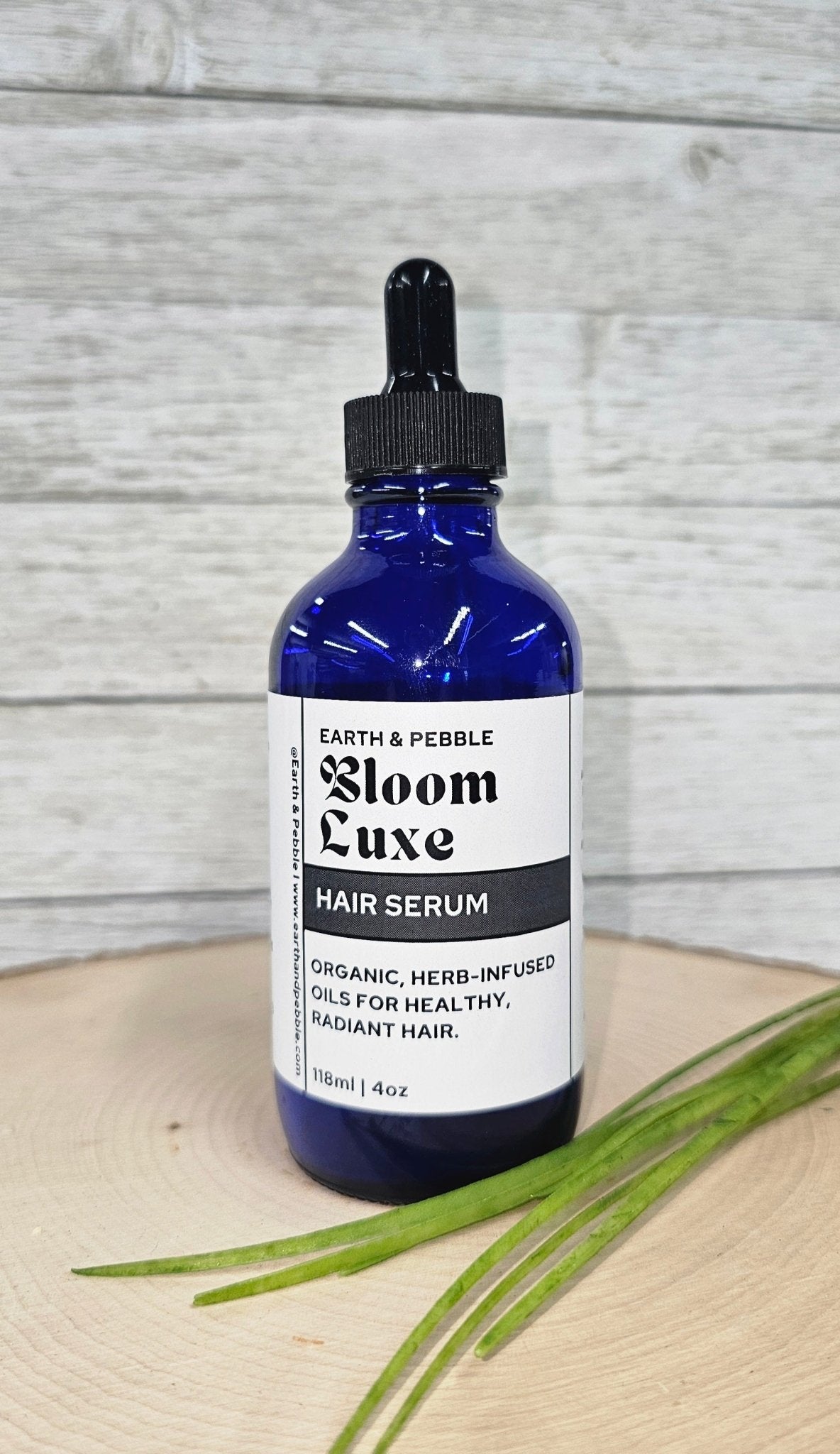 Earth & Pebble Bloom Luxe Herbal Hair Oil with rosemary, amla, bhringraj, and botanical oils for healthy-looking hair